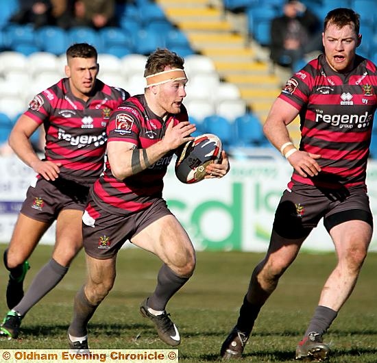 OLDHAM try-scorer Richard Lepori looks for a gap in the Featherstone line.