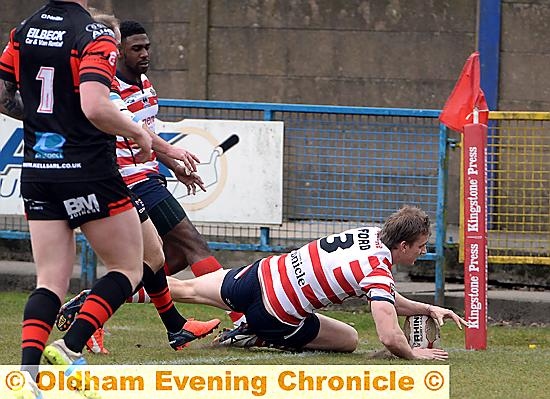 TRY TIME: Jon Ford crosses the line at the corner.
