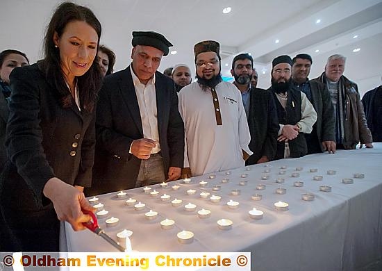 Candlelit vigil in memory of Lahore bomb blast victims: Debbie Abrahams MP lights a candle. Next to her is Abdul Basit Shah (Oldham Mosques Council) and Mufti Helal (officer for Oldham Mosques Council). 