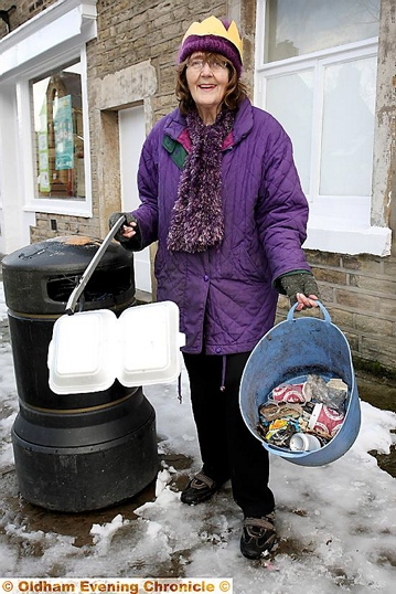 Volunteer Gillian Clark managed to pick up some litter in Delph village, wearing her royal paper grown Volunteer Gillian Clark managed to pick up some litter in Delph village, wearing her royal paper grown