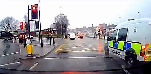 Officers are investigating why this police van - not apparently on an emergency call - went through a red light Officers are investigating why this police van - not apparently on an emergency call - went through a red light