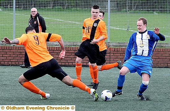 TOE TO TOE . . . Hollinwood’Ωs two-goal hero Matthew Hoggard (right) challenges his Westbury rival for the ball. PICTURE: PAUL STERRITT