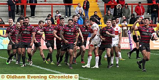 Oldham RLFC players celebrate their outstanding victory over Hull KR in the Ladbrokes Challenge Cup