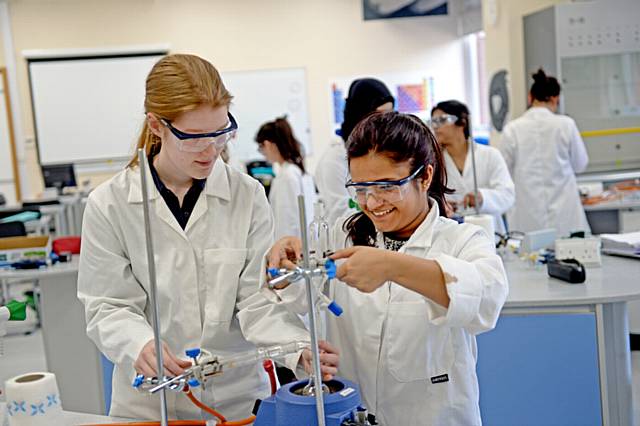 Oldham pupil Mahasweta Ganguly (right) in a chemistry lesson at Withington Girls' School