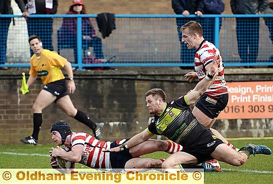 Liam Johnson touches down after chasing down a loose ball