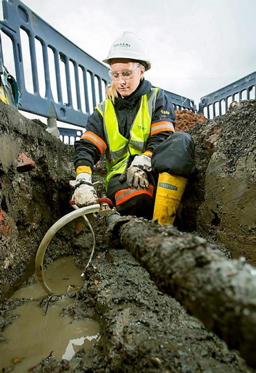 OUT with the old . . . an engineer begins work replacing cables