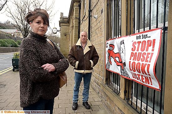 Dona and Graham Unsworth of Jack Essex from Mossley with a road safety campaign poster at Pennine Medical Centre, Mossley