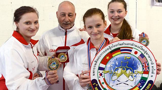 GOLD GLORY . . . Tiree Conway (left), Leah Ellerby and Amelia Gregory with Grand Master Kevin Lloyd. Not pictured: Irena Krcmarova. 