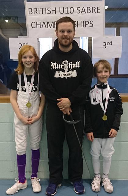 U10s Boys Sabre . . . Alex Lister and U10s Girls Sabre Eleanor Blackledge with head coach Stuart Marshall