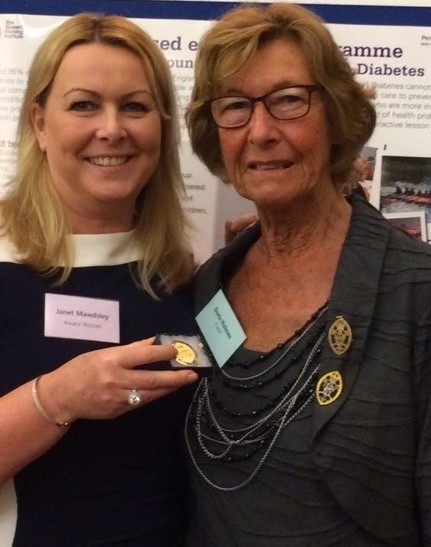 PRESTIGIOUS... Janet Mawdsley, with her Queen's Nurse award and her mum, Doris Holmes.
