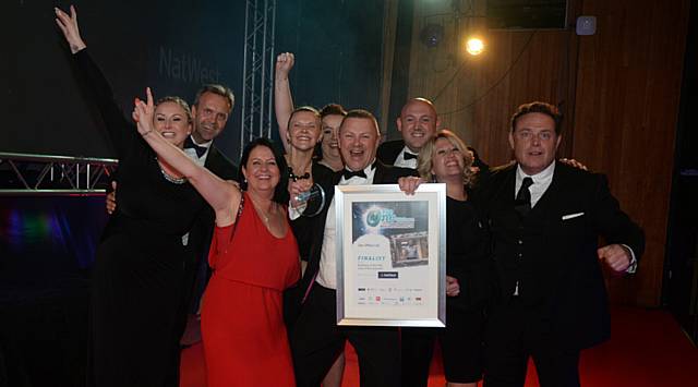 The One Oldham Business Awards 16. Winners Business of the year Award (above £10m turnover) Zen Office celebrate with John Thomson (right)