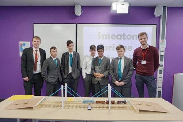 PUPILS show off their suspension bridge.