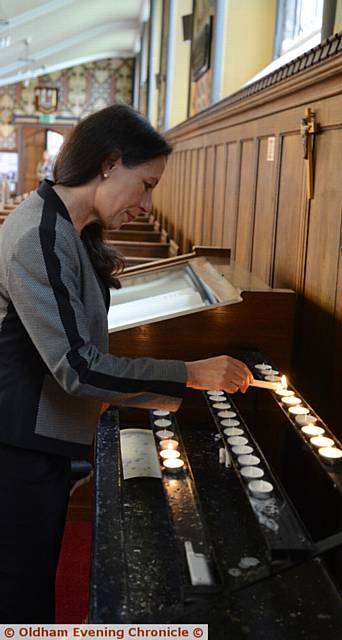 Prayers at Oldham Parish Church for murdered Labour MP Jo Cox. Pic shows Debbie Abrahams MP lighting a candle.