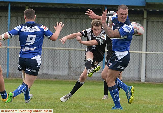 KICKING THROUGH . . . Josh Bradbury, of Saddleworth Rangers, tries to put his side on the front foot at Rochdale Mayfield. PICTURES by TIM BRADLEY