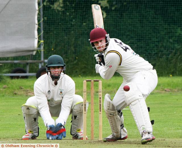 SADDLEWORTH captain Brian Lord goes on the attack against Moorside in the Wood Cup.