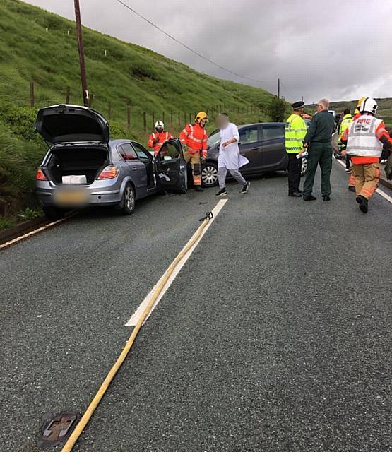 EMERGENCY services deal with the Holmfirth Road crash. 
