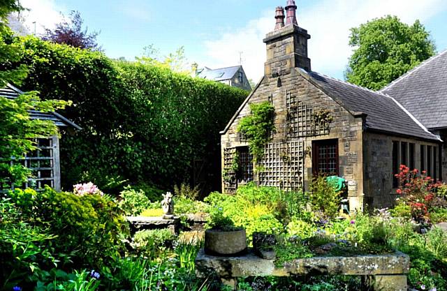 THE picture postcard garden . . . at Moordale Paddock, Huddersfield Road, Diggle