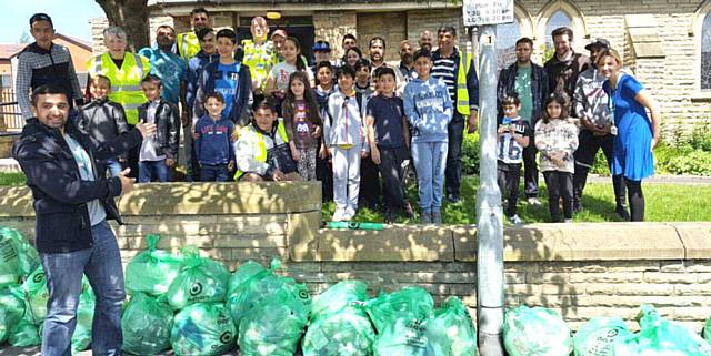 Hathershaw residents tidy up their area. Pictured are councillors Shaid Mushtaq and Jenny Harrison