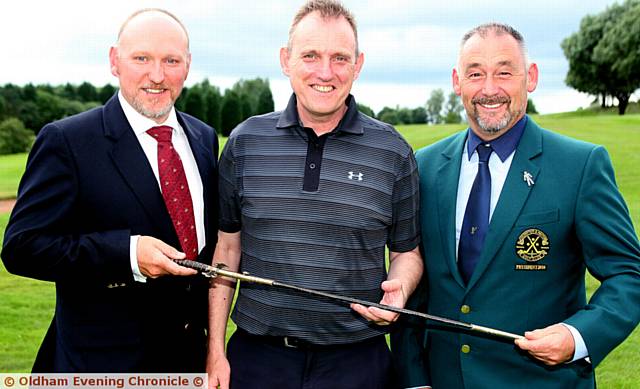 ROGER Smithies receives the Royton Sword for the second time from Barry McLoughlin (left), captain of Crompton and Royton, and club president Steve Horritt