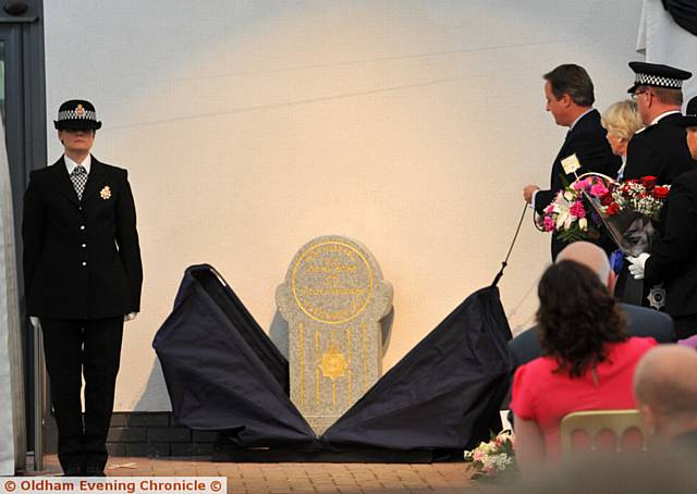 FORMER Prime Minister David Cameron unveils the memorial to PC Fiona Bone and PC Nicola Hughes in Mottram yesterday
