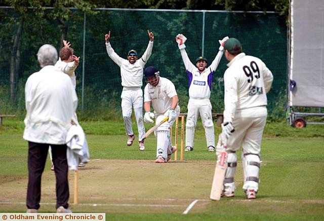 THAT'S OUT . . . Saddleworth opener Danny Hesford is trapped lbw by Walsden bowler Stevie Barker. 