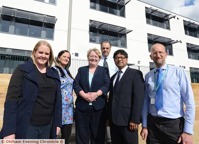 NORTHMOOR Academy almost complete...from left, Councillor Amanda Chadderton, Jessica Hainsworth (principal), Oldham Council leader Councillor Jean Stretton, Conor Hanratty (managing director Extra Space), Councillor Abdul Jabbar (deputy leader Oldham Council) and Barney Harle (capital works and energy manager with Oldham Council
