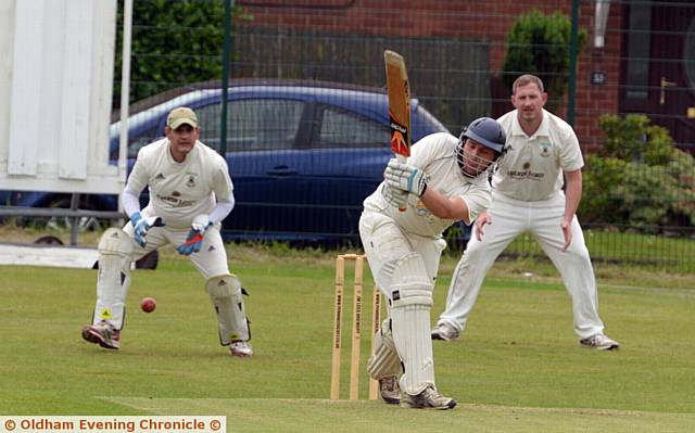 HEYSIDE opener Ben Holt clips the ball away