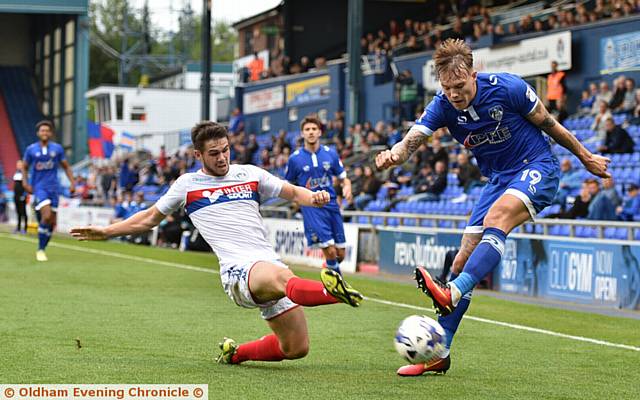 THWARTED . . . Lee Erwin's attempted cross is charged down by a Wigan rival 