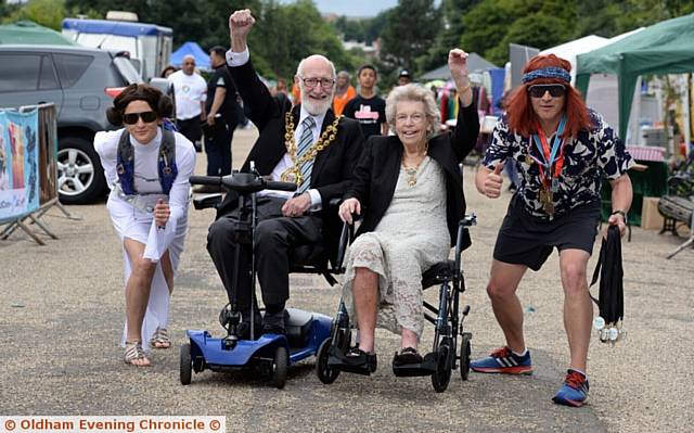 SMILE and a mile . . . organisers Gaynor Keane, Oldham's mayor and mayoress Derek and Di Heffernan and Alan Keane get into the fun. 