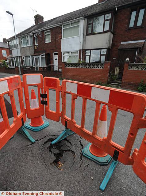 CORDONED off . . . the sink hole on Alcester Street, Chadderton