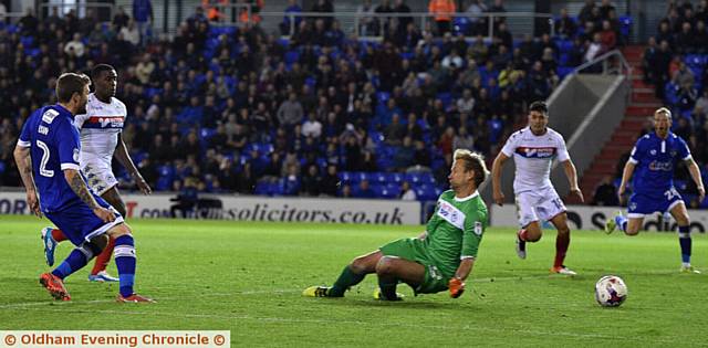 WINNING GOAL . . . Josh Law slides the ball under Jussi Jaaskelainen