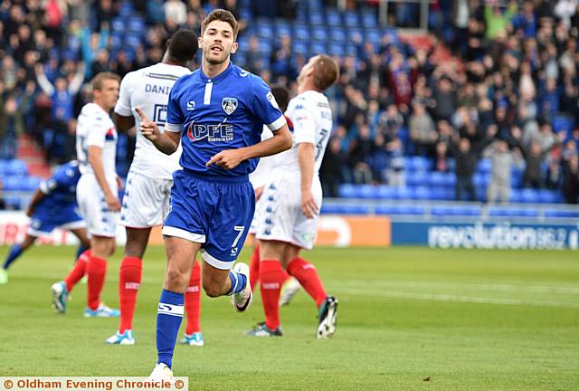 GREAT START . . . Ryan Flynn wheels away after opening the scoring Latics last night at SportsDirect.com Park