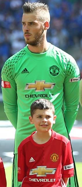 WHAT an honour . . . Adam Levein, from Royton, with Manchester United goalkeeper David de Gea
