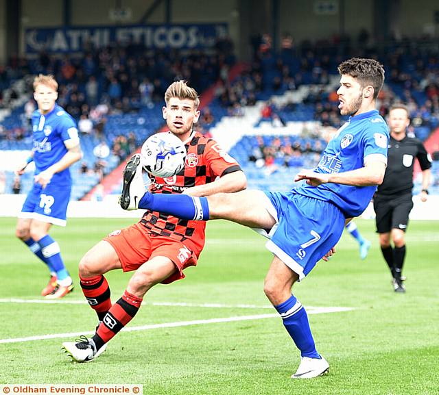 CLOSE CONTROL . . . Athletic midfielder Ryan Flynn brings down the ball under pressure from a Walsall rival
