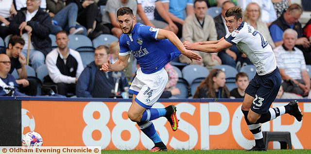 GETTING SHIRTY . . . Athletic striker Jake Cassidy is halted in his progress. PICTURES by ALAN HOWARTH.