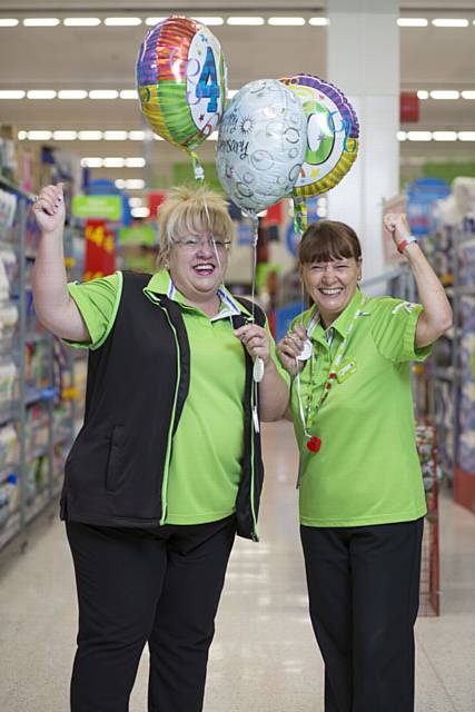 DEDICATION . . .  Carol Powel and Jill Fern celebrate 40 years of service at Asda