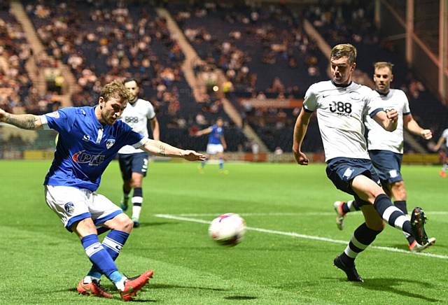 Athletic’s Josh Law taking
on the Preston defence