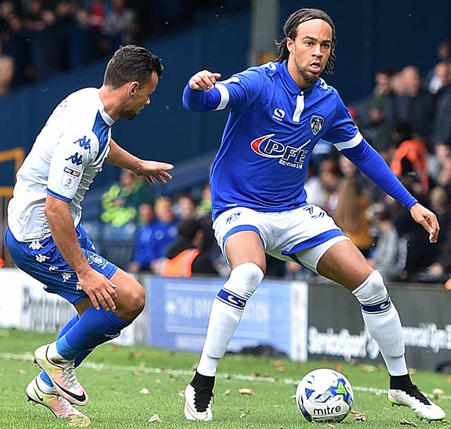 IMPRESSED . . . Charles Dunne shows composure on the ball in the victory at Bury