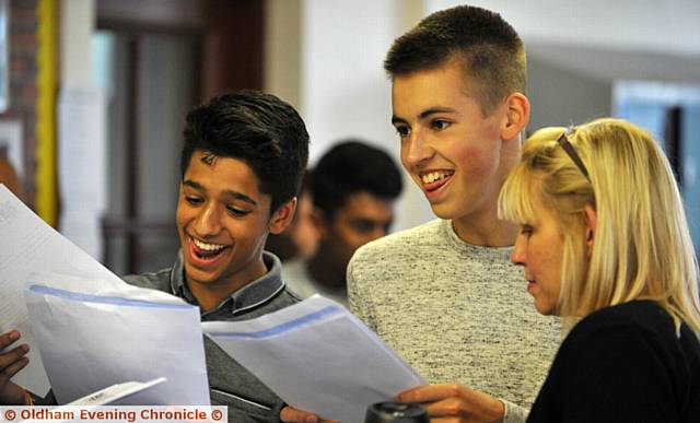 ALL SMILES . . . Prinesh Mistry and Ben Taylor receive their results from staff at Hulme Grammar School ALL SMILES . . . Prinesh Mistry and Ben Taylor receive their results from staff at Hulme Grammar School