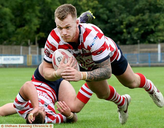 DEBUT TRY . . . Scott Turner gets through the Workington line to score.