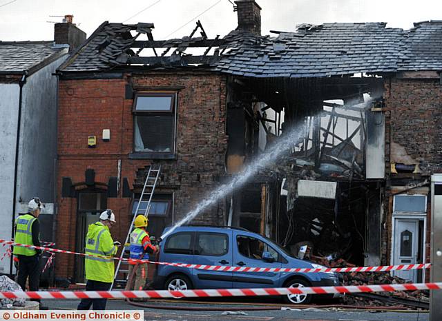 MAJOR incident . . . firefighters deal with the aftermath.