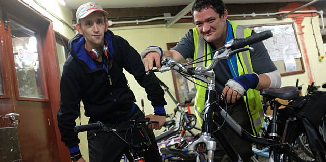 EMMAUS companions Paul Townsend and Stuart Hadfield clued up on cycle maintenance EMMAUS companions Paul Townsend and Stuart Hadfield clued up on cycle maintenance
