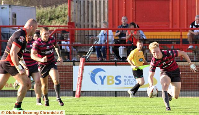 RUNNING IN . . . Kieran Gill puts Oldham's second try on the board