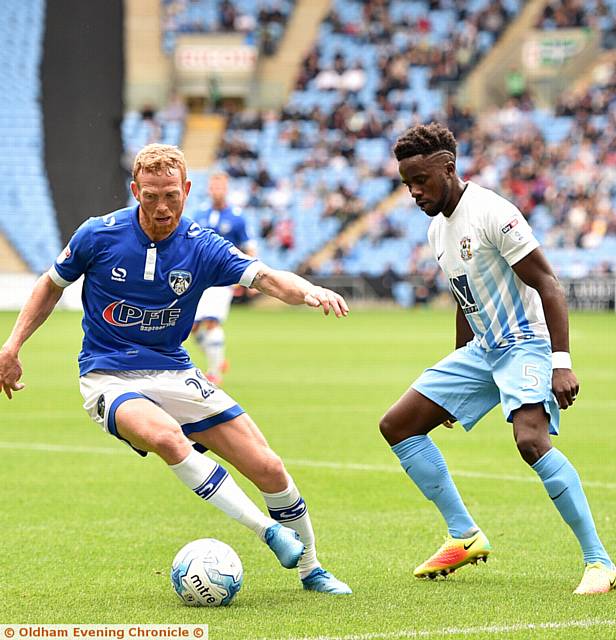 IN POSSESSION . . . Athletic midfielder Paul Green looks to hold off his rival