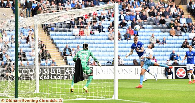 STRIVING TO FIND A BREAKTHROUGH . . . Athletic forward Lee Erwin rises at the far post to get a header on target