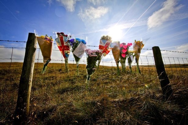 Tributes left at the scene of the crash in Greenfield Road, Saddleworth