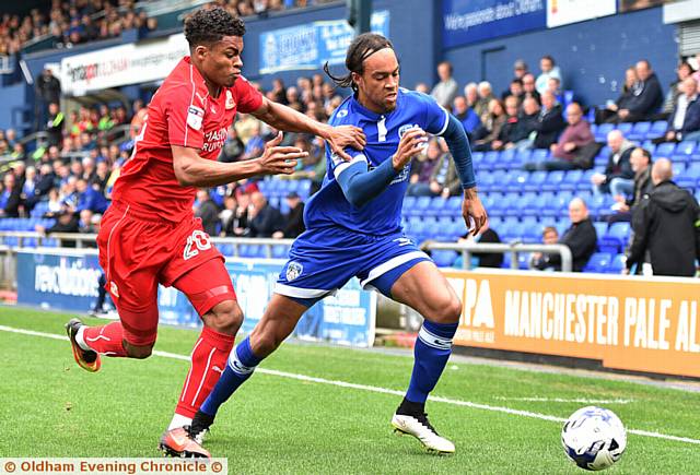 TUSSLE: Athletic's Charles Dunne (right) battles away