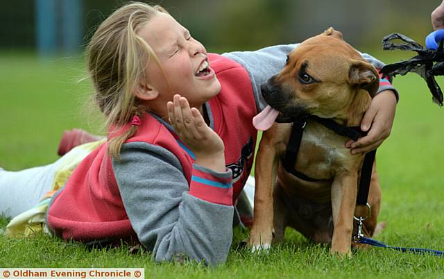 Failsworth and Hollinwood Fun day at Higher Memorial Park. Grace Hall(9) with Lincoln a little rescue puppy go in for the cute dog competition.