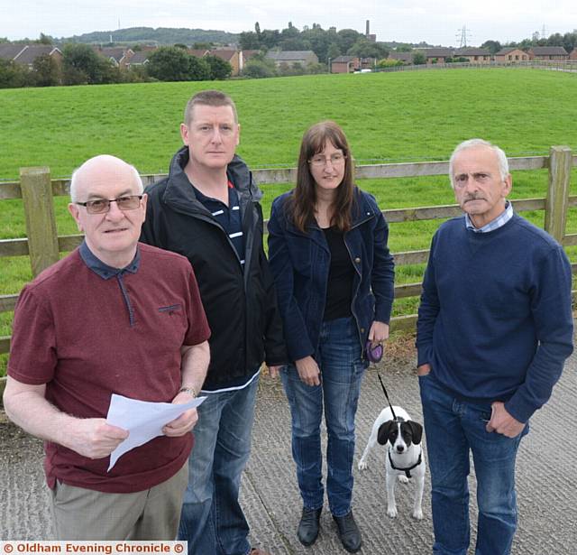 Residents from the Cowlishaw area of Shaw worried about plans to build 125 houses on green space. Left to right, Ken Watson, Neil Hardiker, Anjanette Butterworth with her dog Indie, Tony Faulkner. Residents from the Cowlishaw area of Shaw worried about plans to build 125 houses on green space. Left to right, Ken Watson, Neil Hardiker, Anjanette Butterworth with her dog Indie, Tony Faulkner.