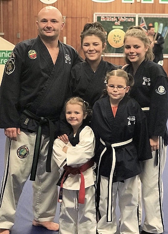 Lee Usher, Jade, Natasha, Ellie with her black belt, and Lilly 